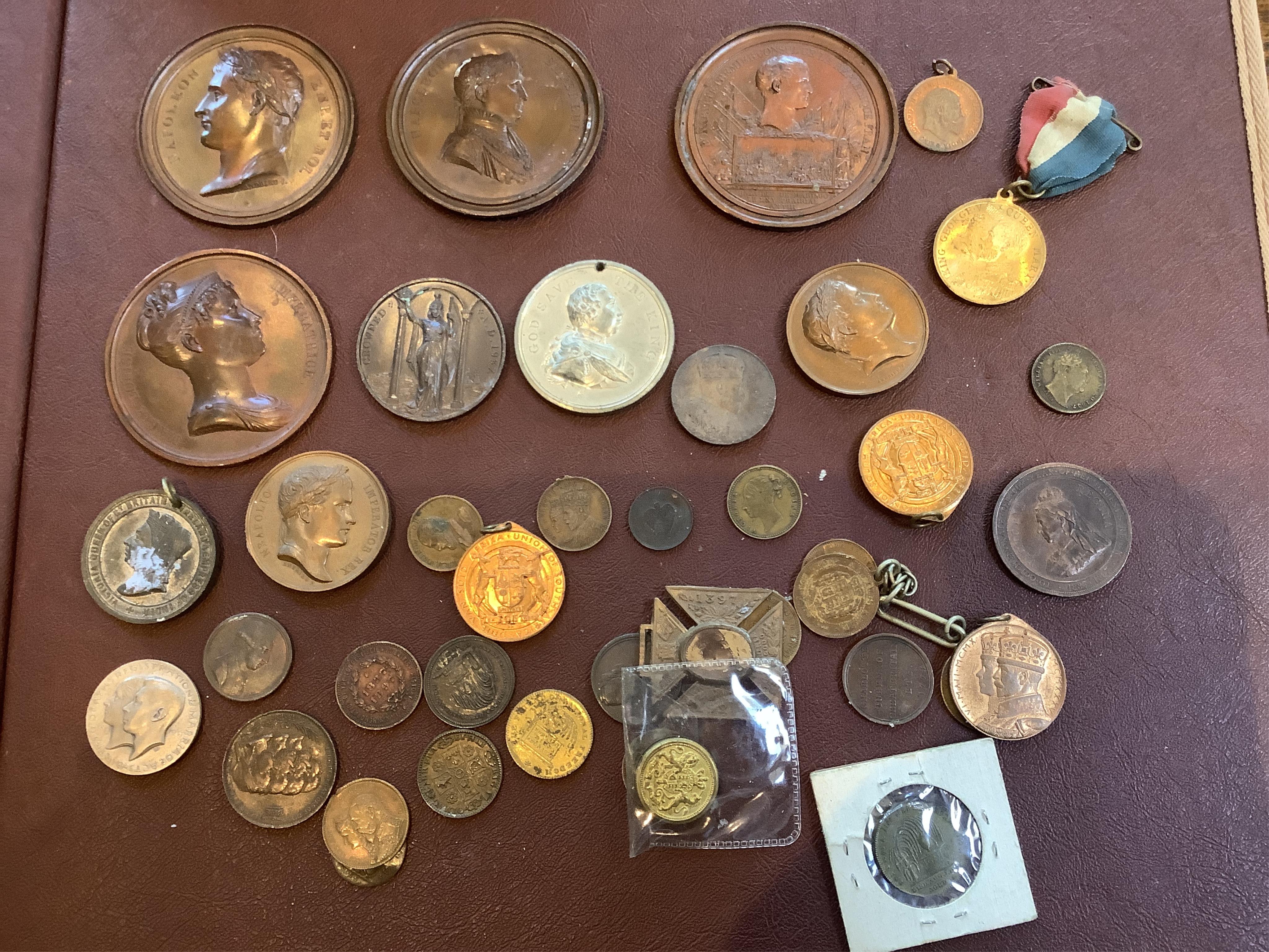 A collection of 19th/20th century Royal commemorative medallions, Napoleon portrait plaques etc.